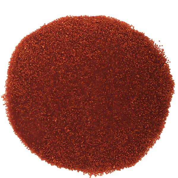Indion NIP ion exchange resin beads, red-brown colored, for anion removal in water purification.
